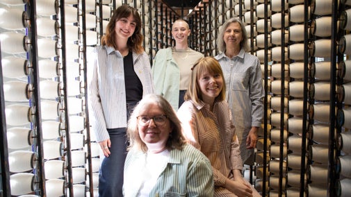 Five models wearing pieces from the new Community Clothing range